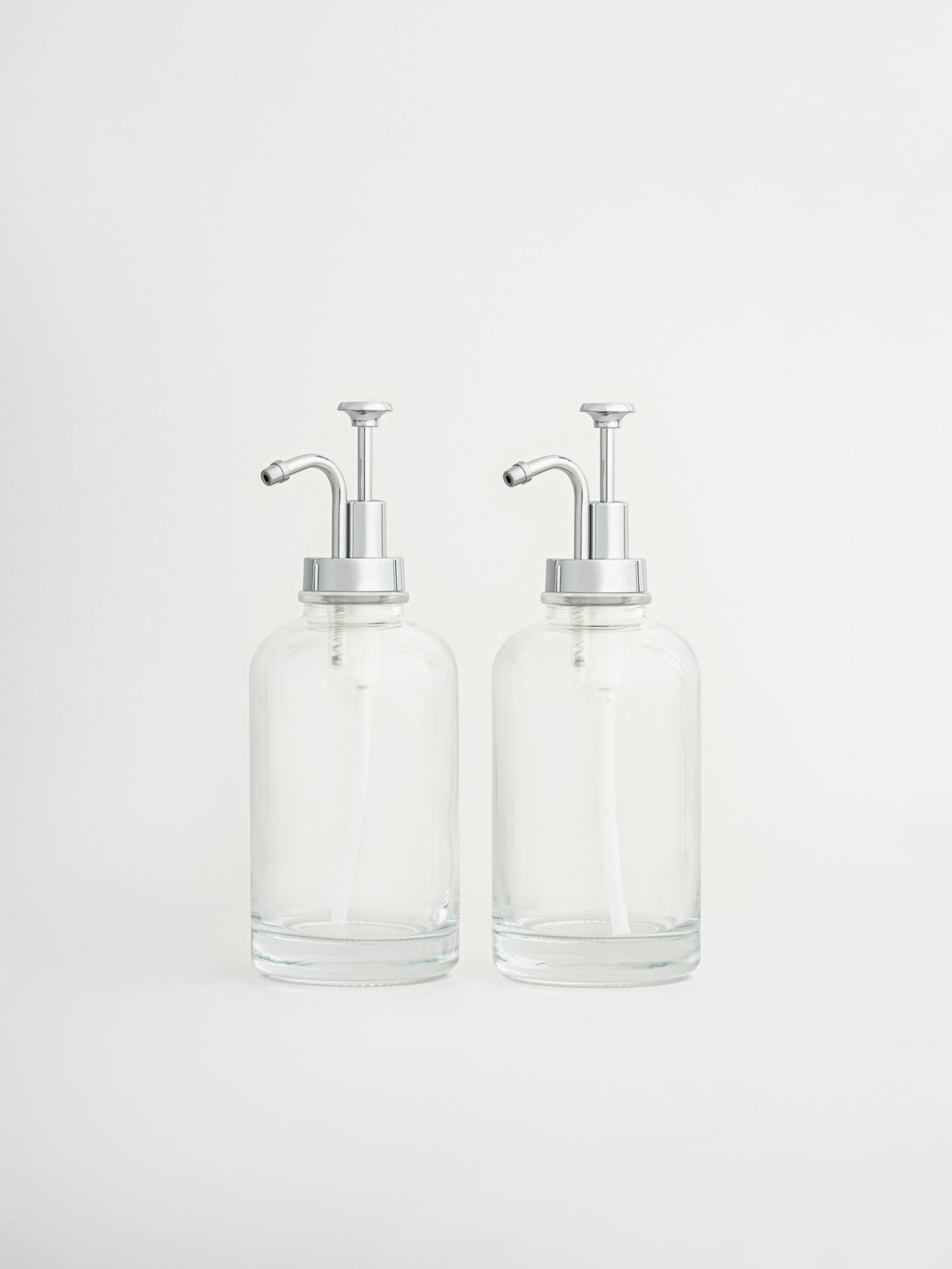 coffee syrup dispensers set, silver syrup pump bottles, coffee bar accessories, dispenser bottles with silver pump, set of 2 syrup dispensers, modern coffee station setup, pump bottles for syrup, stylish coffee bar tools, silver pump coffee bottles, reusable syrup dispensers, elegant kitchen dispenser set, barista syrup pumps, coffee syrup bottles silver top, café-style syrup pumps, kitchen organizer bottles, syrup bottle set silver, countertop coffee accessories, home café essentials, BPA-free pump bottles