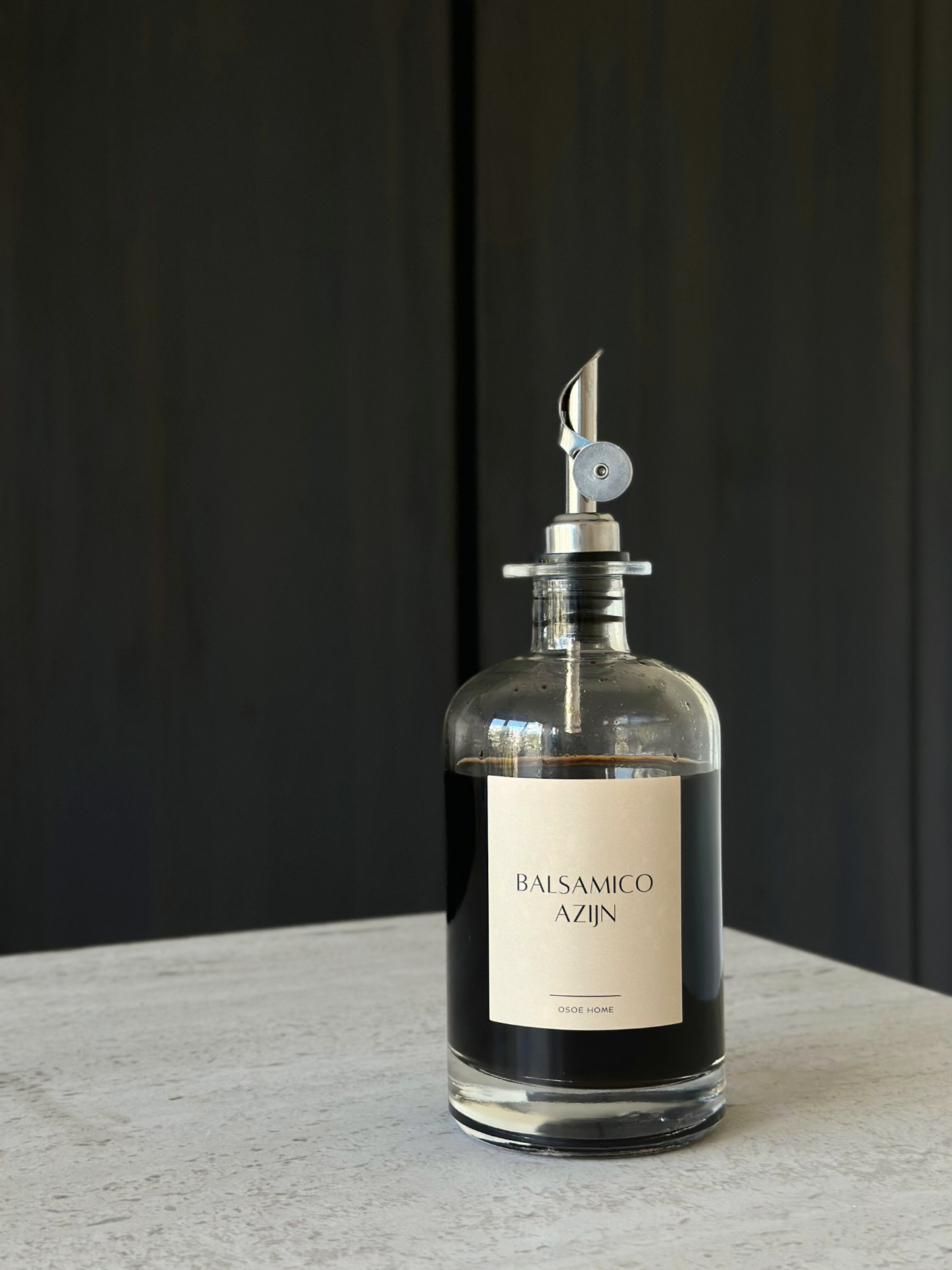 Set of two glass oil and vinegar dispensers with sleek silver caps and modern pour spouts, designed to elevate your kitchen organization. These clear, reusable bottles offer a stylish and functional way to store your favorite condiments while maintaining a clutter-free, minimalist countertop. The silver details add a refined, timeless touch that pairs beautifully with other organizing essentials from brands like Ikea, Hema, and Temu. Ideal for tidy pantries, curated kitchen zones, and sustainable home setup