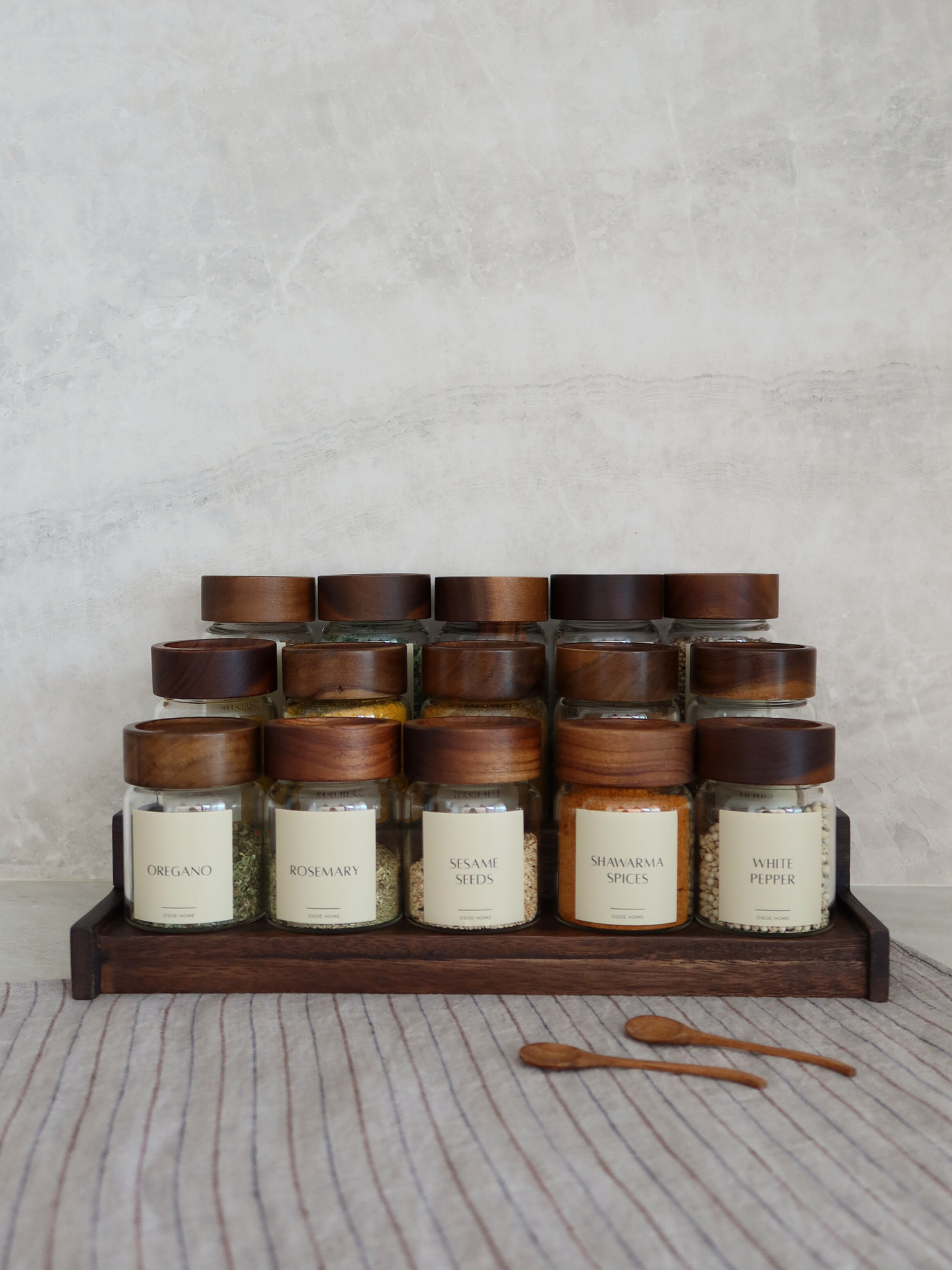 Dark brown wooden spice rack, wooden spice rack dark brown, wooden spice rack with spice jars, spice jars wooden rack, neatly store spice jars, stylish spice jar holder, sustainable wooden spice jar organizer, spice jars and spice rack, spice rack for spice jars, kitchen wood organizer, natural kitchen storage, wooden spice rack home organizing, compact spice jar rack, organizer for spice jars, wooden spice rack set, dark wood spice rack