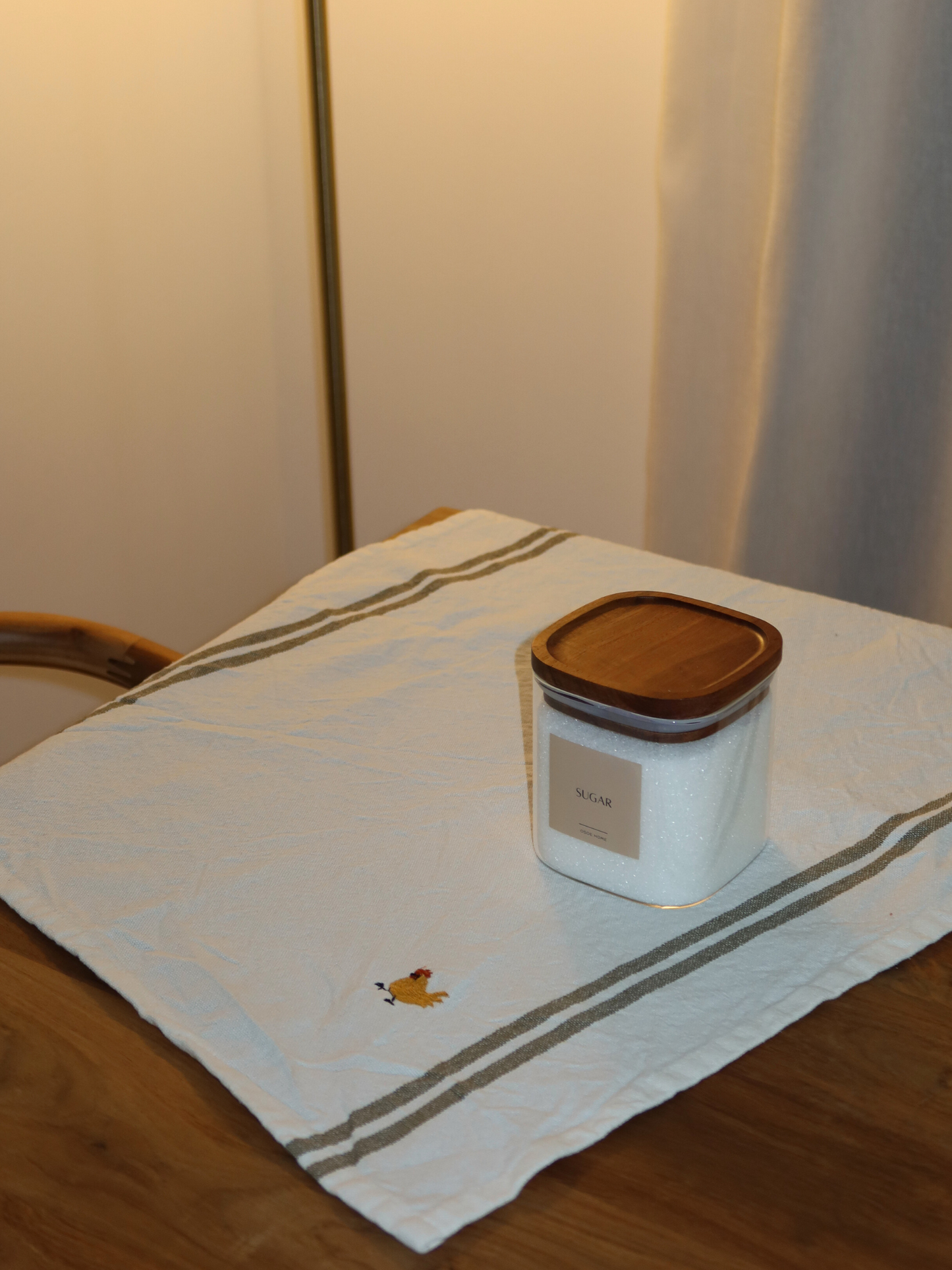 Square storage jar brown lid; square glass storage jar; storage jar with wooden lid; storage jar with brown wooden lid; square airtight storage jar; storage jar with screw lid; kitchen organizing storage jar; storage jar with label; stackable storage jar; transparent storage jar; small and large storage jar; storage jar set; square storage jar with lid; storage jar made of natural materials; storage jar with stylish lid; glass storage jar with brown lid; bamboo alternative storage jar.