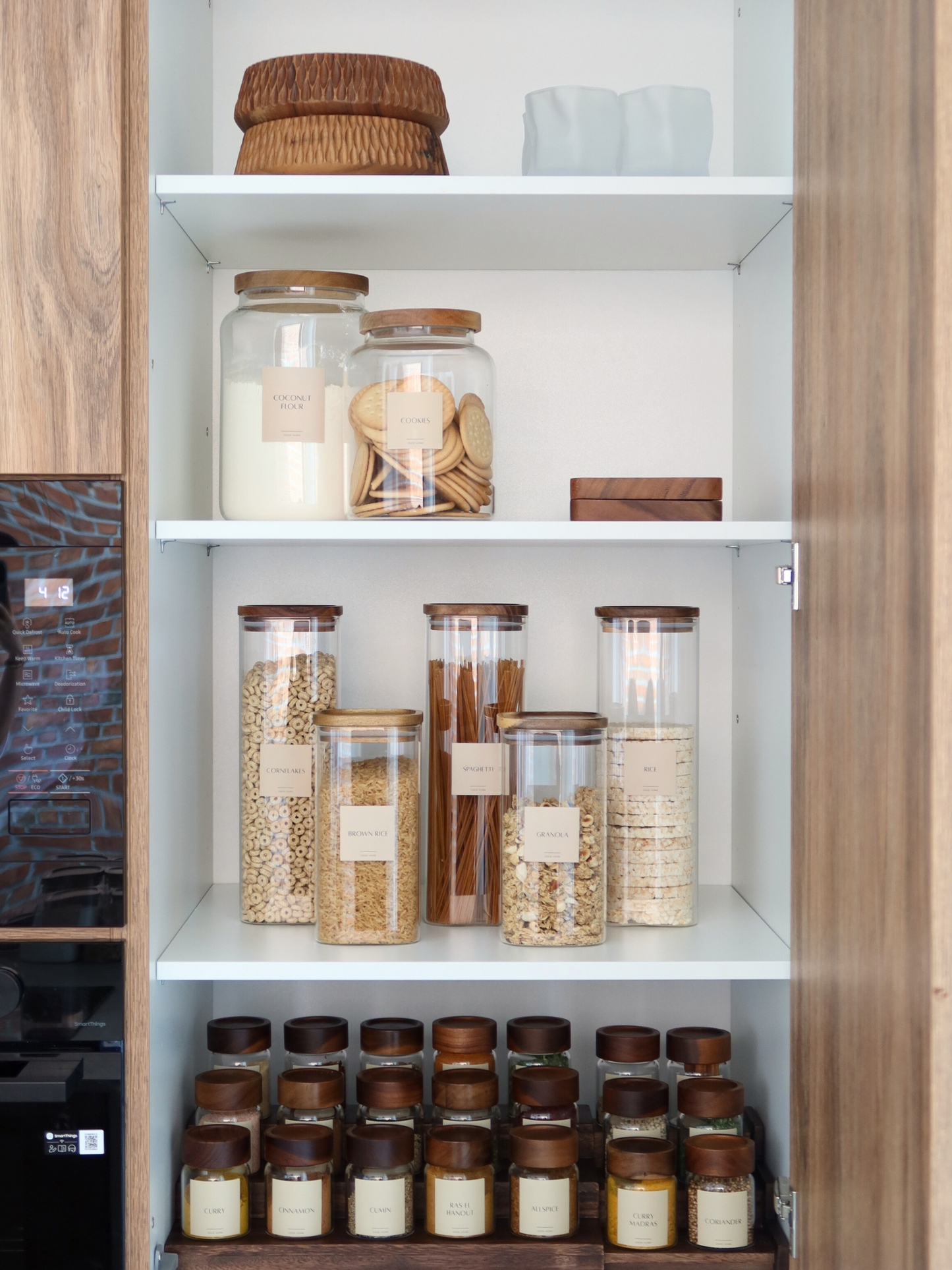 Square storage jar brown lid; square glass storage jar; storage jar with wooden lid; storage jar with brown wooden lid; square airtight storage jar; storage jar with screw lid; kitchen organizing storage jar; storage jar with label; stackable storage jar; transparent storage jar; small and large storage jar; storage jar set; square storage jar with lid; storage jar made of natural materials; storage jar with stylish lid; glass storage jar with brown lid; bamboo alternative storage jar.