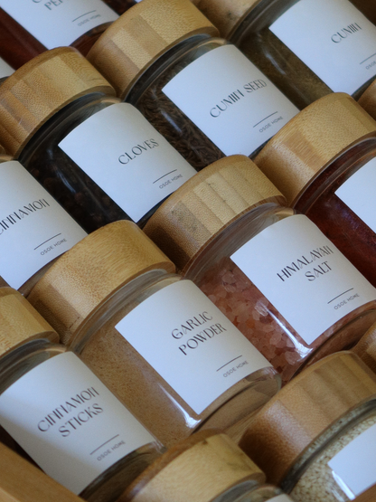 Airtight glass spice jar Yen with screw cap and thick bamboo wooden lid for elegant spice storage and modern kitchen organization, made from toxin-free, BPA-free, PFAS-free and microplastic-free materials, designed to keep herbs and spices fresh for longer while creating a calm and organized spice rack aesthetic, featuring a transparent glass jar and natural bamboo lid that perfectly complements minimalist pantry styling and sustainable kitchen decor.