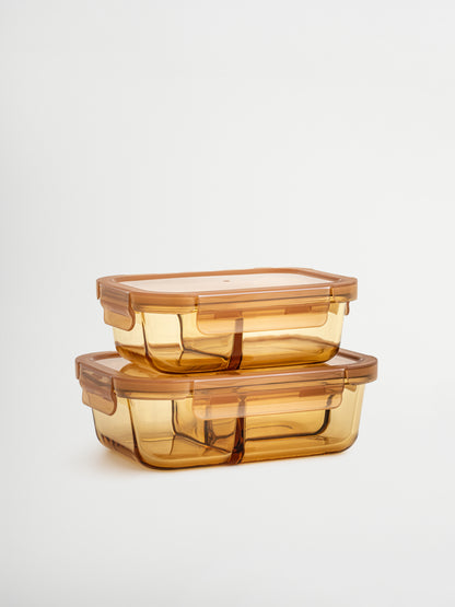 Zad is an amber-colored glass container with a glass lid and refined amber/brown accents, combining style and functionality. The integrated glass divider keeps multiple ingredients organized. Perfect for balanced lunches, meal prep, or storing leftovers. Non-toxic, BPA-free, odor- and stain-resistant glass makes it durable, easy to clean, leak-proof, and ideal for mindful, stylish storage in kitchen, fridge, or lunch bag.