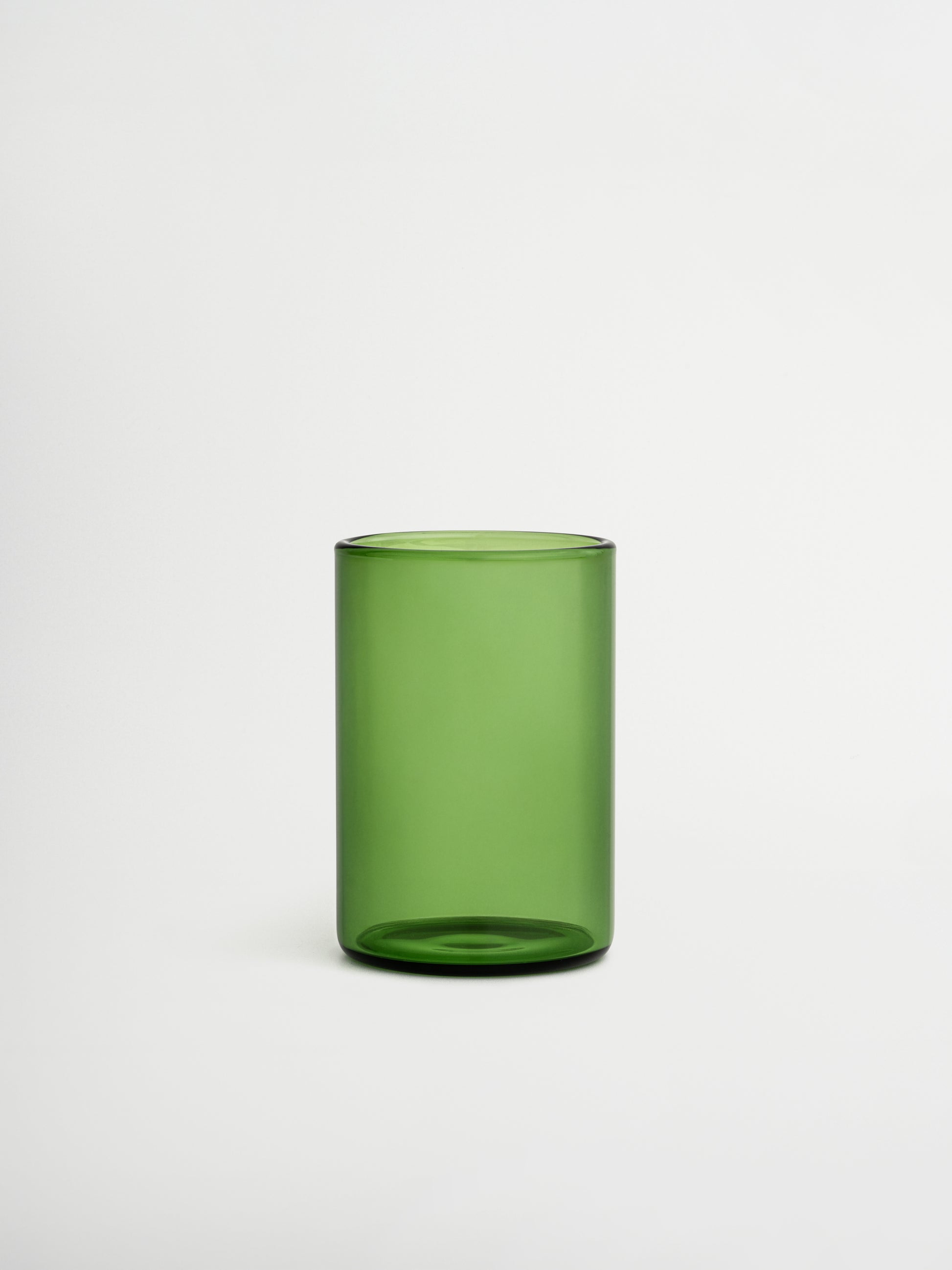 Give your table a trendy upgrade with Glass Naoki, featuring a taller design and deep green color that adds a subtle, restaurant-style touch. Perfect for water, soft drinks, or chilled beverages during dinner. Made entirely from green borosilicate glass, combining timeless elegance with practical durability. Heat-resistant and strong enough for daily use, yet refined enough to enhance any table setting. Sold individually, allowing you to choose exactly how many glasses complete your collection.