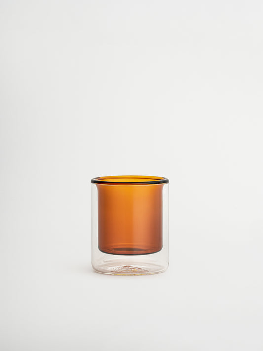 Straight espresso glass in a warm cognac brown tone, ideal for serving espresso shots or other coffee beverages. The elegant, minimalist design adds a luxurious touch to your coffee moments and fits beautifully in a modern, stylish kitchen or coffee corner. Made from durable glass for daily use, offering a sustainable and aesthetic reusable drinking experience.