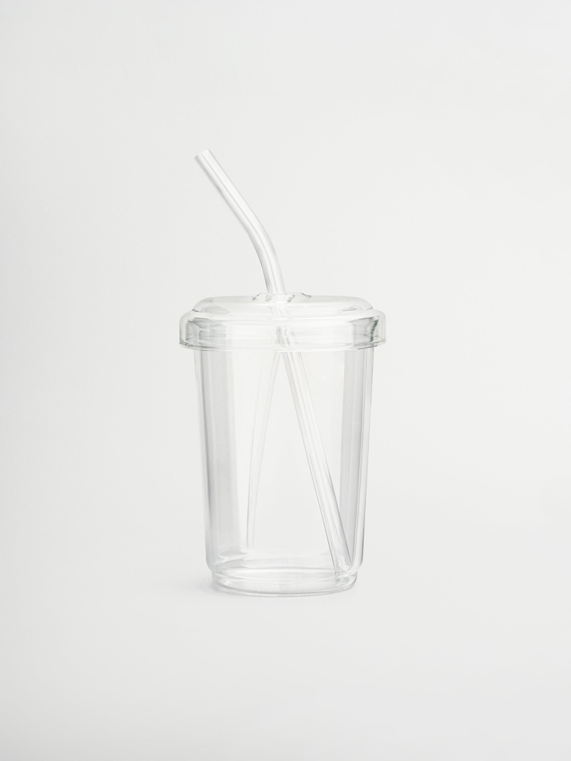 Reusable borosilicate glass cup with matching lid and straw, perfect for enjoying hot or cold drinks like iced coffee, tea, or matcha. This aesthetic glass tumbler combines style and sustainability, made from premium borosilicate glass that’s both lightweight and durable. Ideal for a minimalist home or office setup, it enhances your daily routine while reducing plastic waste. A must-have for aesthetic drinkware lovers who value clean design and eco-conscious living.

