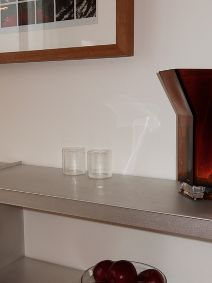 Glass Yuki with a straight shape and elegant grooves, perfect for styling your table beautifully without being too bold. The grooved design catches the light beautifully and gives water, soft drinks, or chilled beverages that extra touch of refinement. Made from durable, heat-resistant borosilicate glass, it’s strong enough for daily use while adding a restaurant-like elegance to your setting. Sold individually and can be paired with the matching carafe (sold separately) for a complete set.