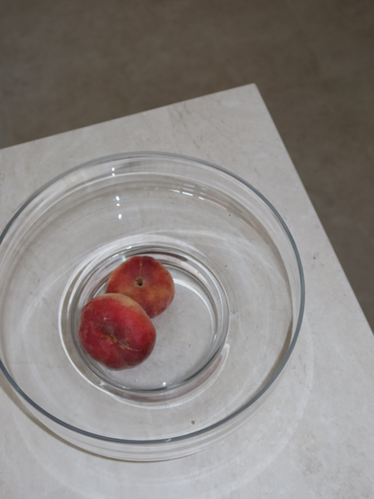 An elegant base for your fruit, Glass Bowl Shin is a spacious, large glass bowl perfect for displaying fruit in a natural and stylish way. Its clear, glass-like appearance highlights everything inside, from juicy apples to colorful citrus, making your presentation stand out. With soft curves and a minimalist design, Shin doubles as a decorative object. Made from clear, durable borosilicate glass, it is strong yet lightweight, adding a fresh and elegant touch to any table or kitchen.