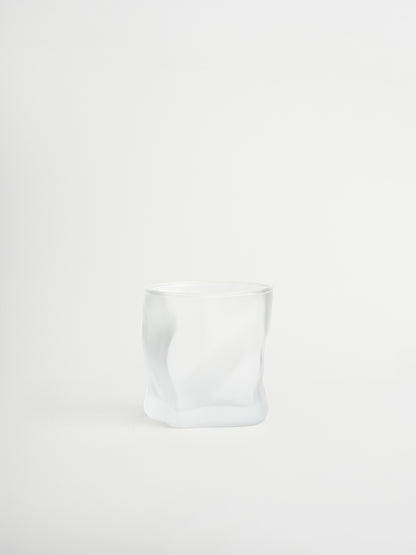 Glass tumbler Roca with a unique rock-shaped design for stylish serving of water, cocktails and other beverages, made from durable and sturdy glass with a matte finish that creates a modern and striking look, designed for a comfortable grip and a cohesive glassware collection to replace mismatched glasses, perfect for minimalist and elegant table styling and ideal for everyday use while creating a consistent and elevated drinking experience at home.