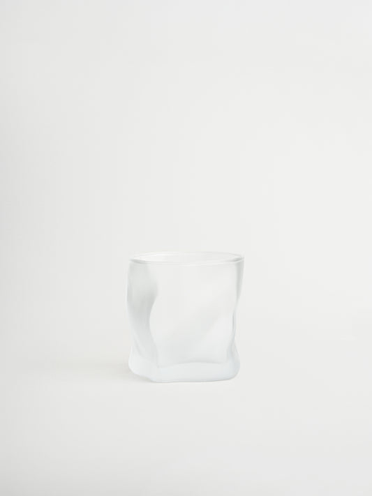 Glass tumbler Roca with a unique rock-shaped design for stylish serving of water, cocktails and other beverages, made from durable and sturdy glass with a matte finish that creates a modern and striking look, designed for a comfortable grip and a cohesive glassware collection to replace mismatched glasses, perfect for minimalist and elegant table styling and ideal for everyday use while creating a consistent and elevated drinking experience at home.