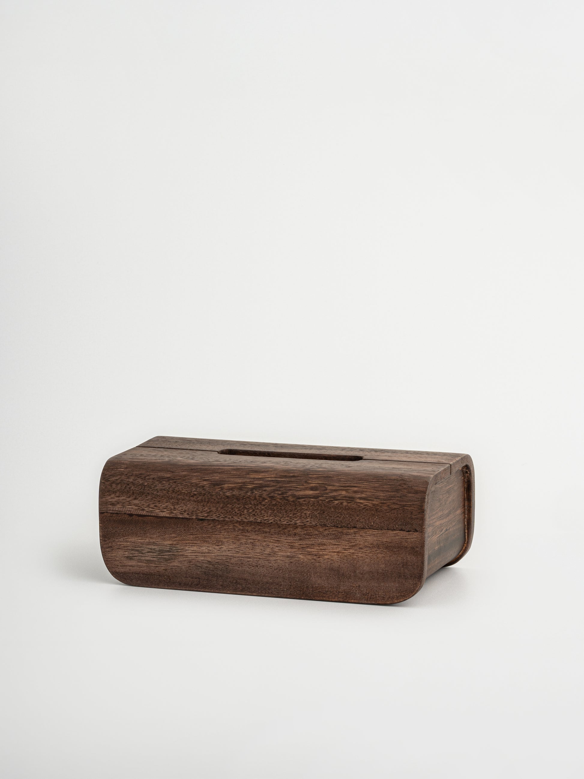 Handmade Borneo wooden tissue box holder crafted from natural, durable wood with a rich dark brown finish. This luxury wooden tissue holder features a minimalist design with a fitted lid, designed to neatly store standard tissue boxes while enhancing a calm and organized interior. A stylish and sustainable wooden tissue box organizer that complements both bathroom and living room spaces, adding warmth, elegance, and a natural look. An elegant Borneo wood accessory. 