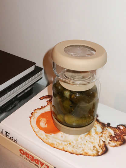 Hygienic and convenient: no more digging with your fingers. With Torshi, you’ll never have to awkwardly reach into the jar to retrieve pickles or other preserved treats. The glass holder with a soft beige finish provides a clean, practical way to store and serve your pickles, keeping your fridge tidy and everything fresh and organized. Made from high-quality, BPA-free, and non-toxic glass, Torshi is safe, durable, and resistant to odors and stains. Easy to clean and designed for everyday use, it’s a conscio