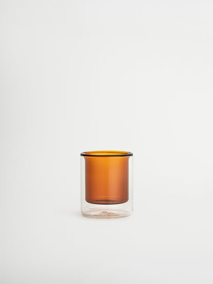 Straight espresso glass in a warm cognac brown tone, ideal for serving espresso shots or other coffee beverages. The elegant, minimalist design adds a luxurious touch to your coffee moments and fits beautifully in a modern, stylish kitchen or coffee corner. Made from durable glass for daily use, offering a sustainable and aesthetic reusable drinking experience.