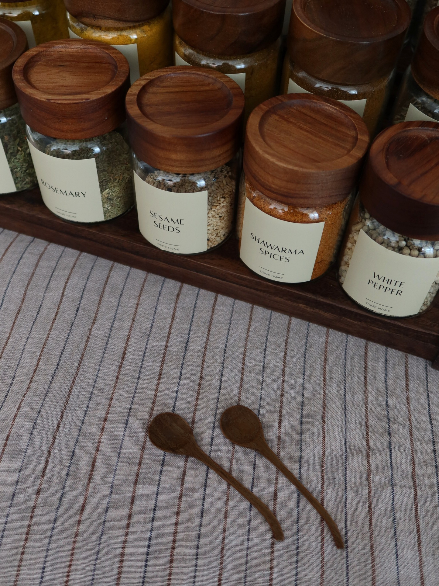 Small natural wooden spice spoon designed for spice jars, seasoning containers, herbs, salt, sugar, and spices. This compact wooden measuring spoon is a practical kitchen accessory for scooping and serving seasonings while keeping your pantry organised. Crafted from durable natural wood, it is an eco-friendly kitchen utensil that fits perfectly inside spice jars and complements modern, farmhouse, Scandinavian, and minimalist kitchen décor. Ideal for home organisation, spice storage, and everyday cooking ess