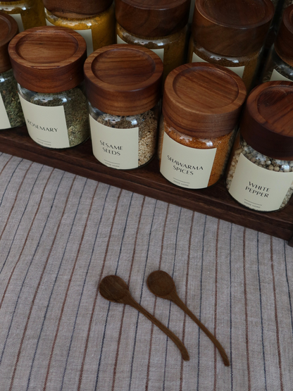 Small natural wooden spice spoon designed for spice jars, seasoning containers, herbs, salt, sugar, and spices. This compact wooden measuring spoon is a practical kitchen accessory for scooping and serving seasonings while keeping your pantry organised. Crafted from durable natural wood, it is an eco-friendly kitchen utensil that fits perfectly inside spice jars and complements modern, farmhouse, Scandinavian, and minimalist kitchen décor. Ideal for home organisation, spice storage, and everyday cooking ess