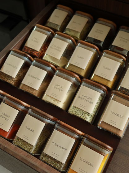 Bring calm and order to your kitchen with the Kai spice jar. Its smart square shape makes it easy to line up neatly in your cupboard or drawer, while giving you a clear overview of your herbs and spices at a glance. The clear glass jar is crafted from sturdy glass and finished with a square acacia wood lid featuring a tight rubber seal to keep contents fresh and aromatic for longer. A timeless and functional design that adds a natural, refined touch to any kitchen. Perfect to mix with other storage product.