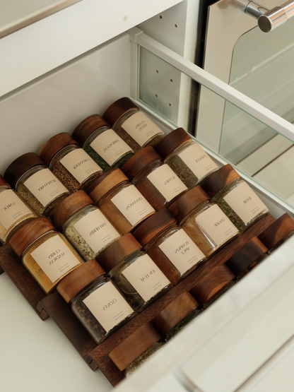 Dark brown Borneo wood Dusan drawer spice rack, neatly organizing glass spice jars inside your kitchen drawer. This compact, stylish wooden spice jar organizer keeps every jar in place, offering durable natural wood storage that turns a cluttered kitchen drawer into a clean, functional spice rack set. Perfect for small kitchens, this dark wood spice jar holder combines timeless design with everyday practicality — a lasting, tidy storage solution from Osoehome.