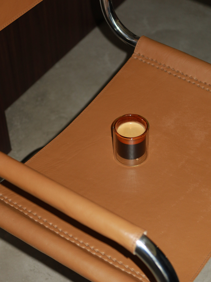 Straight espresso glass in a warm cognac brown tone, ideal for serving espresso shots or other coffee beverages. The elegant, minimalist design adds a luxurious touch to your coffee moments and fits beautifully in a modern, stylish kitchen or coffee corner. Made from durable glass for daily use, offering a sustainable and aesthetic reusable drinking experience.