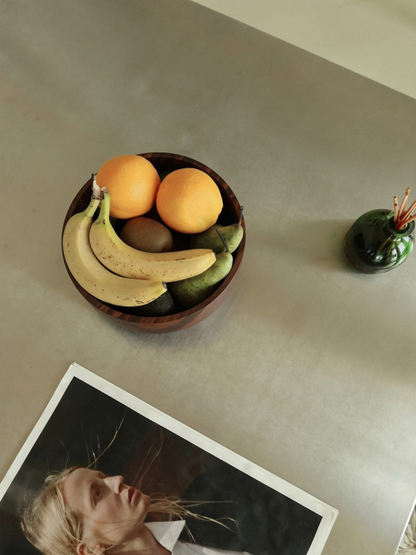Handcrafted brown wooden fruit bowl for elegantly storing and serving fruit, snacks, sweets or salads in the kitchen or dining room. Made from high-quality and durable wood with a rich, deep finish that highlights the natural wood grain. Designed as a spacious and functional statement piece for both modern and classic interiors, with a smooth polished surface for easy cleaning and long-lasting use. Perfect for stylish home organisation and table presentation.