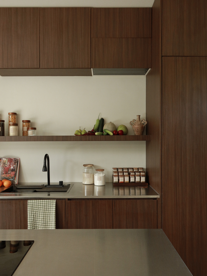 Dark brown wooden spice rack with glass jars and wooden lids, natural wood kitchen organizer for drawer storage, wooden bowl and fruit bowl, small wooden spoon and bamboo spoon, light and dark wood home organizing accessories for kitchen or bathroom. Wood organizers for kitchen or bathroom including wooden spice jars, glass storage jar with wooden lid, drawer divider and organizer in dark brown wood, wooden bowl, bamboo spoon and natural wood kitchen accessories in light or dark finish.
