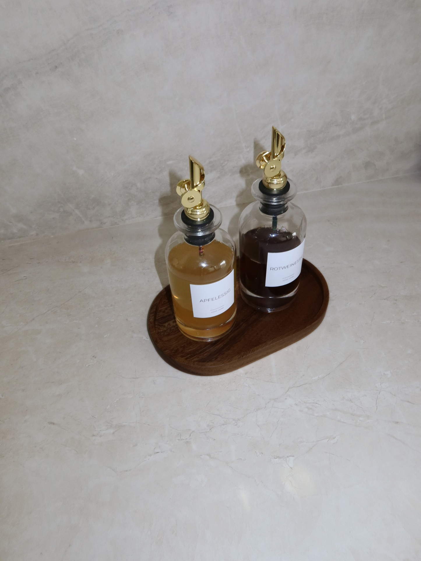 Round wooden organizing plate crafted from natural wood, designed as a stylish kitchen countertop tray for spice jars, oil and vinegar dispensers, soap dispensers, seasoning containers, and everyday kitchen accessories. This minimalist wooden organiser provides an elegant and durable storage solution for keeping countertops neat, organised, and clutter-free while complementing modern, Scandinavian, farmhouse, and rustic home décor.
