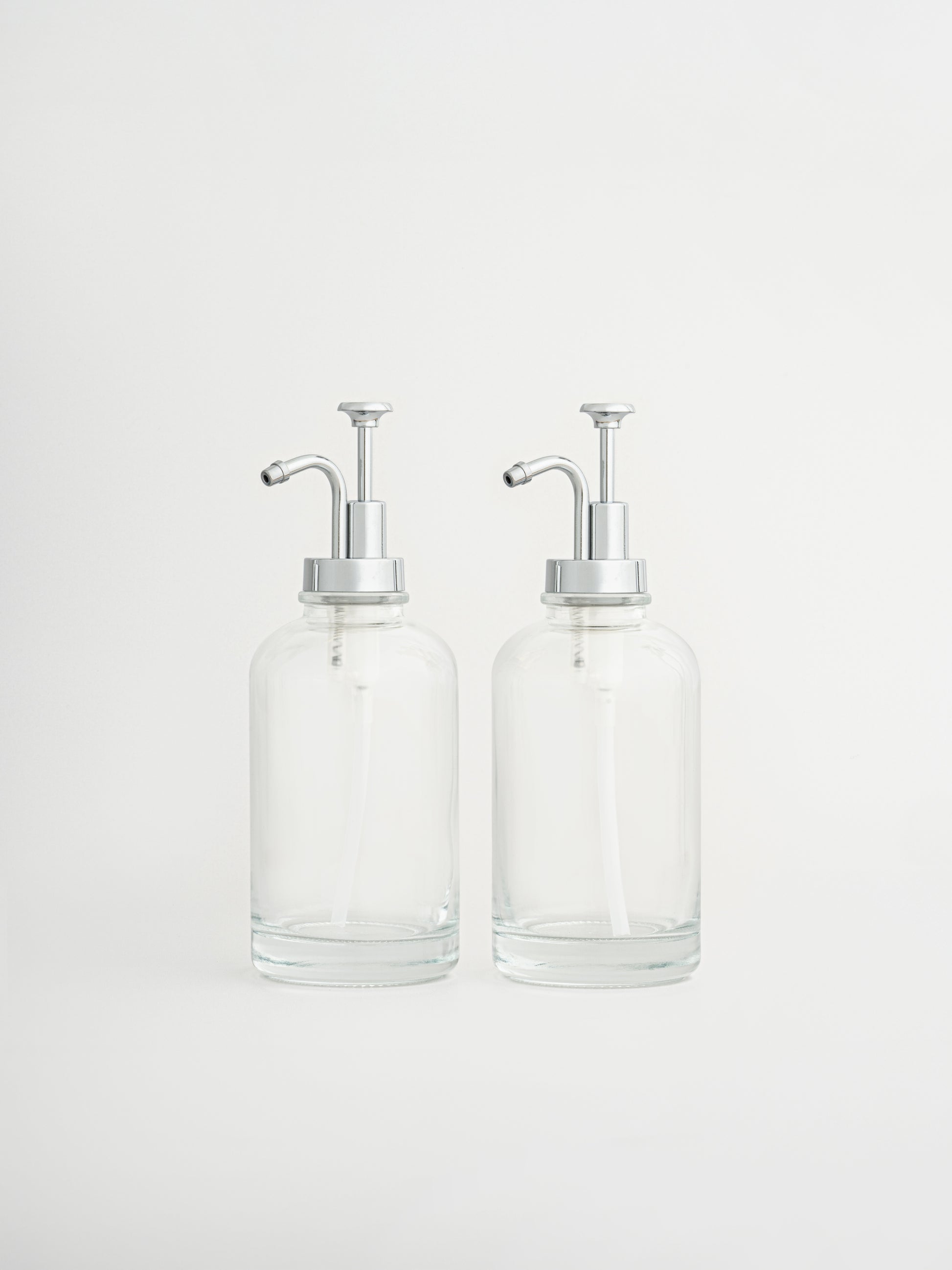 coffee syrup dispensers set, silver syrup pump bottles, coffee bar accessories, dispenser bottles with silver pump, set of 2 syrup dispensers, modern coffee station setup, pump bottles for syrup, stylish coffee bar tools, silver pump coffee bottles, reusable syrup dispensers, elegant kitchen dispenser set, barista syrup pumps, coffee syrup bottles silver top, café-style syrup pumps, kitchen organizer bottles, syrup bottle set silver, countertop coffee accessories, home café essentials, BPA-free pump bottles