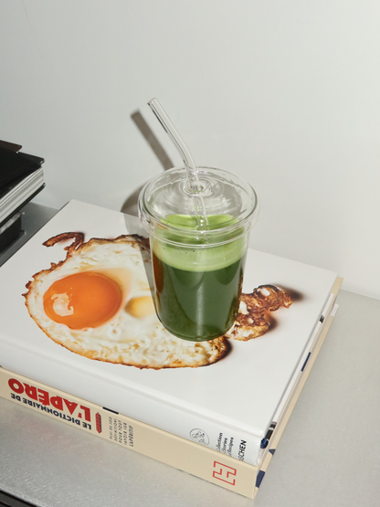 Reusable borosilicate glass cup with matching lid and straw, perfect for enjoying hot or cold drinks like iced coffee, tea, or matcha. This aesthetic glass tumbler combines style and sustainability, made from premium borosilicate glass that’s both lightweight and durable. Ideal for a minimalist home or office setup, it enhances your daily routine while reducing plastic waste. A must-have for aesthetic drinkware lovers who value clean design and eco-conscious living.
